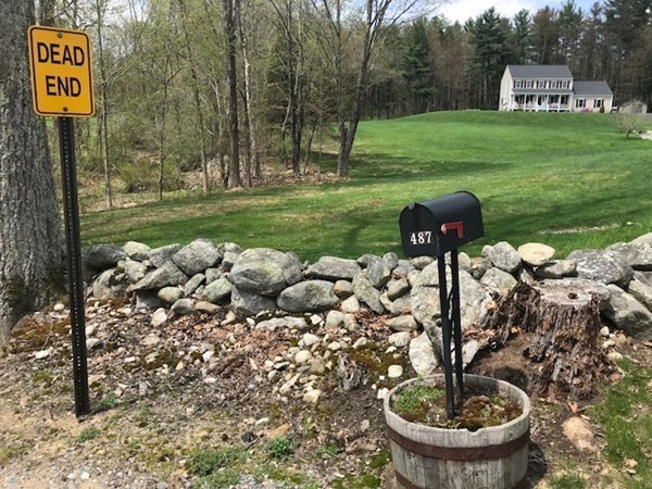 487 Sheldon Road Fitchburg, MA 01420 - Photo 11 of 27 a lake view with a bench and trees around