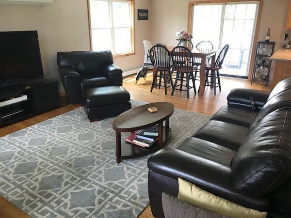 487 Sheldon Road Fitchburg, MA 01420 - Photo 12 of 27 a living room with furniture a flat screen tv and a window