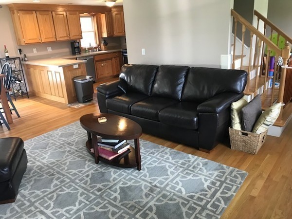 487 Sheldon Road Fitchburg, MA 01420 - Photo 13 of 27 a living room with furniture and a rug