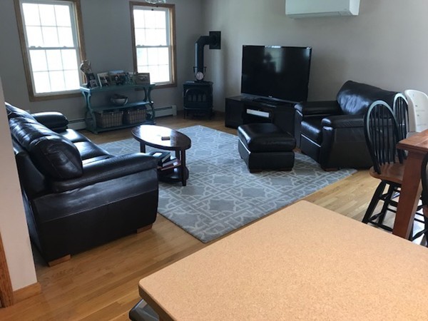 487 Sheldon Road Fitchburg, MA 01420 - Photo 14 of 27 a living room with furniture and a flat screen tv