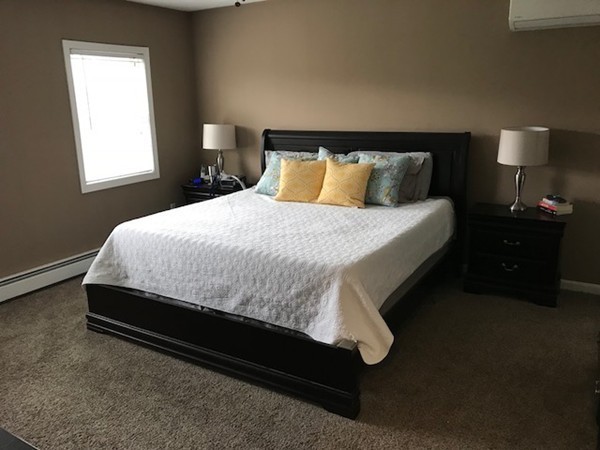 487 Sheldon Road Fitchburg, MA 01420 - Photo 25 of 27 a bed sitting in a bedroom next to a window