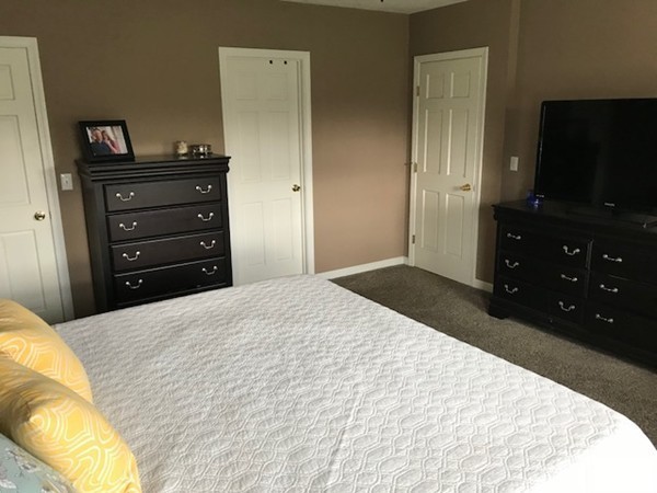 487 Sheldon Road Fitchburg, MA 01420 - Photo 27 of 27 a bedroom with a bed and a flat screen tv