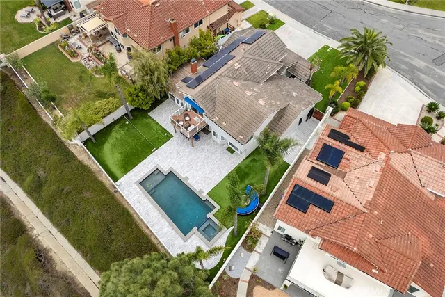 an aerial view of a house with a garden