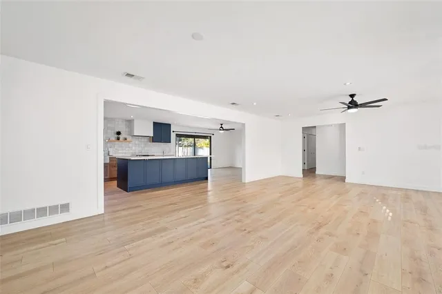 a kitchen with cabinets appliances and a sink
