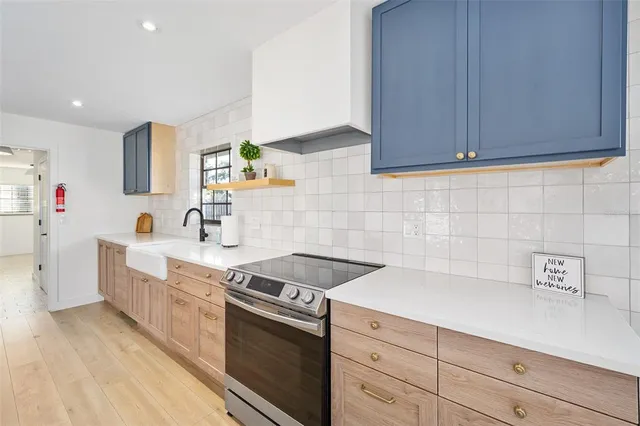 a view of a house with a yard and entertaining space