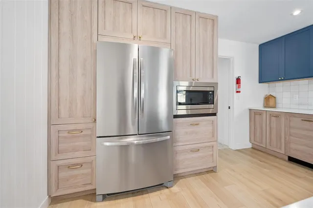 a view of a garden with a building in the background