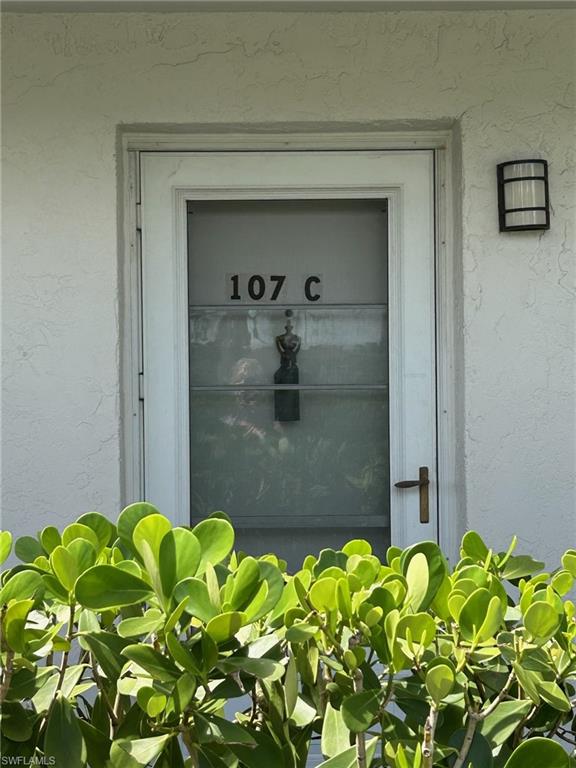 5651 Rattlesnake Hamm Road, Unit C107 Naples, FL 34113 - Photo 4 of 20 ENTRANCE TO THE CONDO