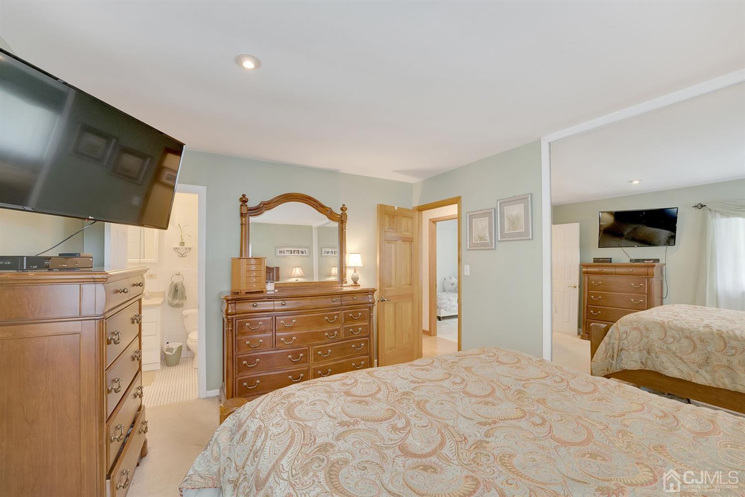 30 Savage Road Kendall Park, NJ 08824 - Photo 12 of 20 a bedroom with a bed and a flat screen tv