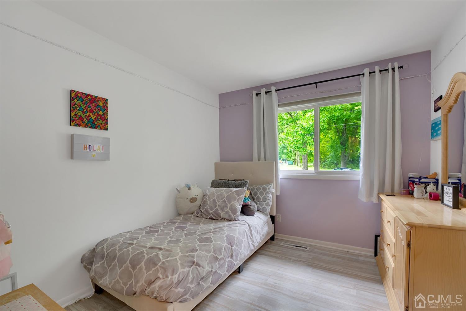 30 Savage Road Kendall Park, NJ 08824 - Photo 14 of 20 a bedroom with a bed and a dresser next to a window