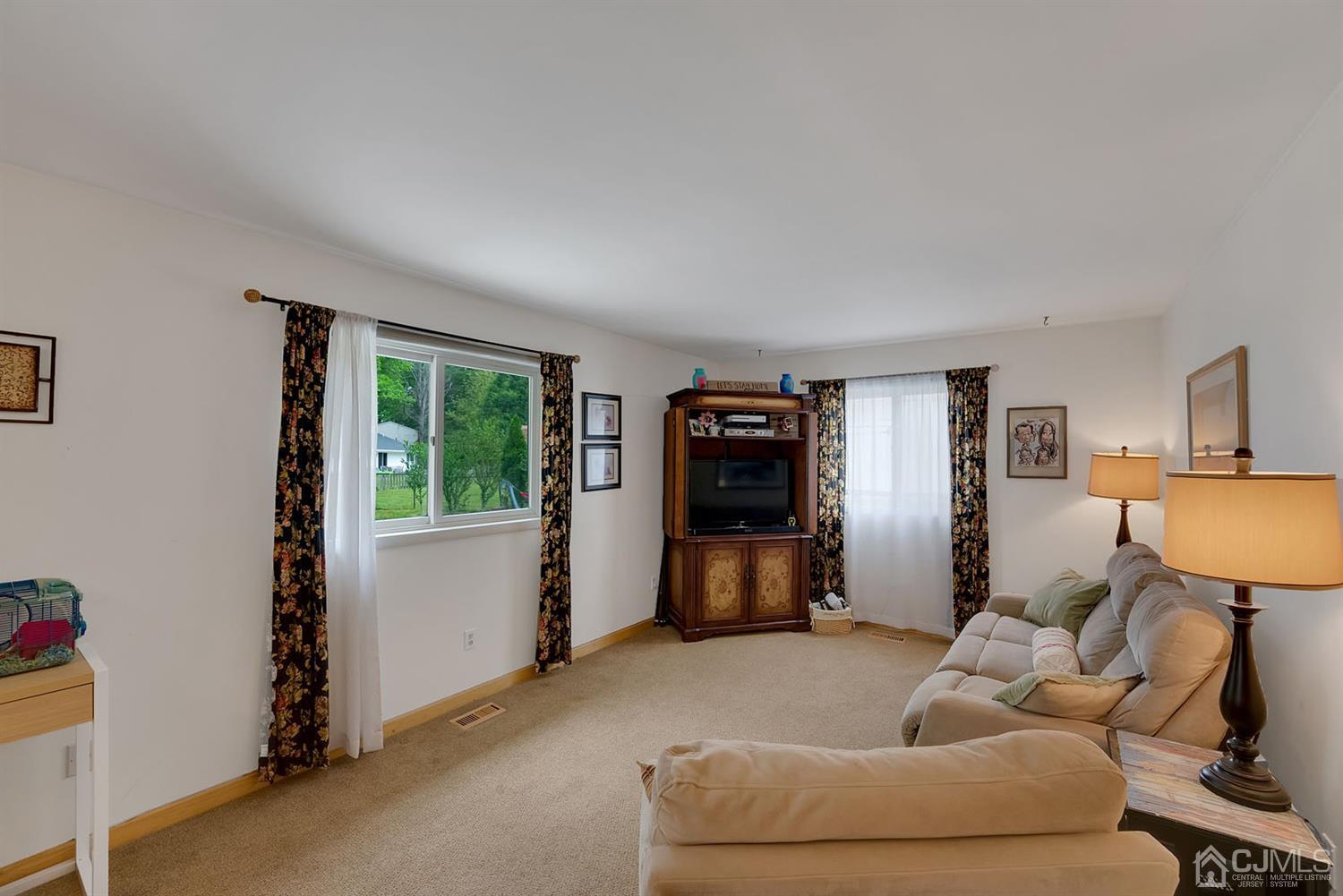 30 Savage Road Kendall Park, NJ 08824 - Photo 16 of 20 a living room with furniture and a flat screen tv