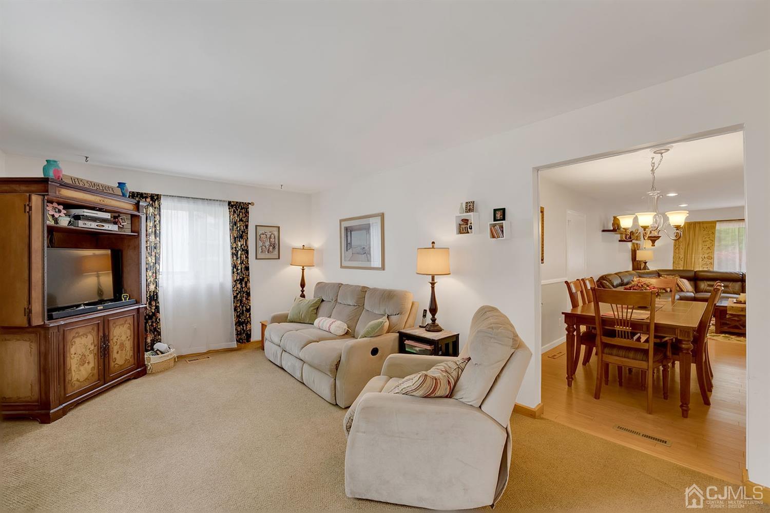 30 Savage Road Kendall Park, NJ 08824 - Photo 17 of 20 a living room with furniture and a flat screen tv