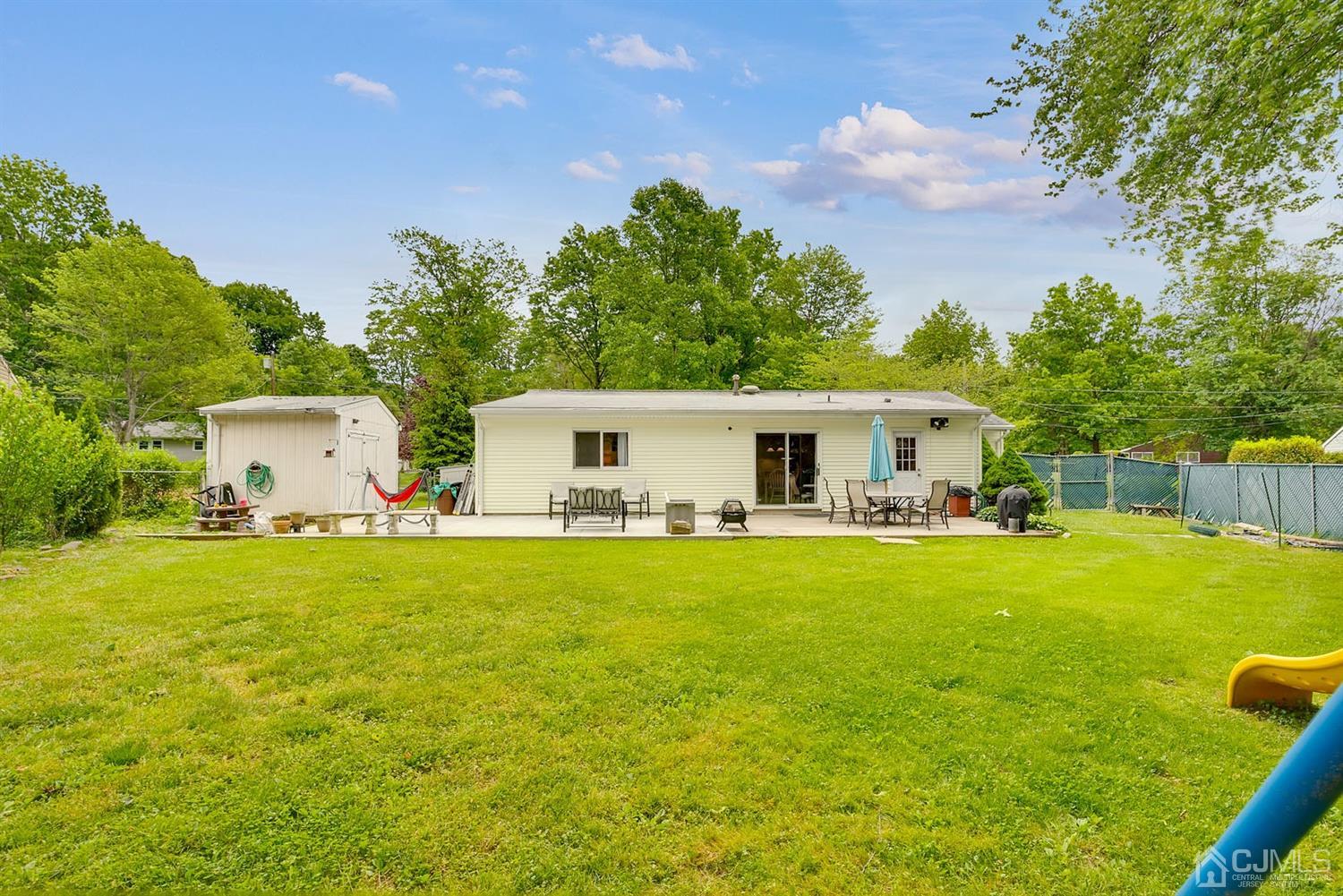 30 Savage Road Kendall Park, NJ 08824 - Photo 20 of 20 a front view of house with yard and trees