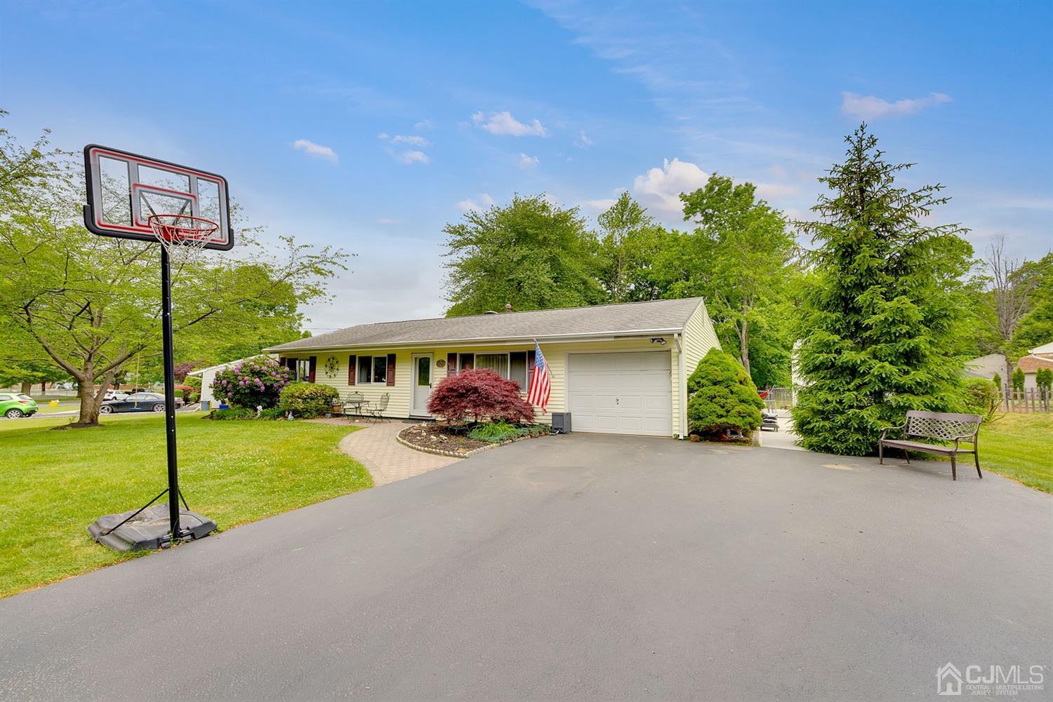 30 Savage Road Kendall Park, NJ 08824 - Photo 3 of 20 a view of a house with backyard and a slide