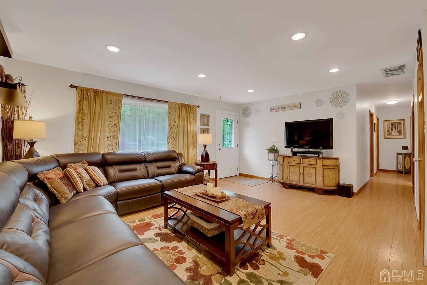 30 Savage Road Kendall Park, NJ 08824 - Photo 6 of 20 a living room with furniture and a flat screen tv