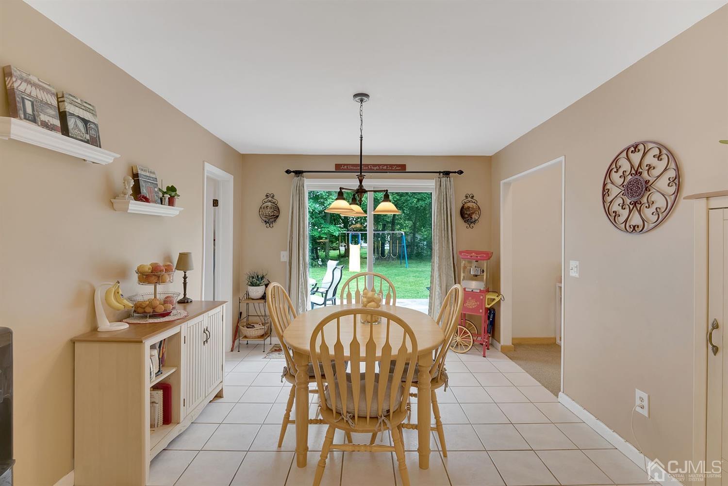 30 Savage Road Kendall Park, NJ 08824 - Photo 9 of 20 a dining room with furniture a chandelier and window