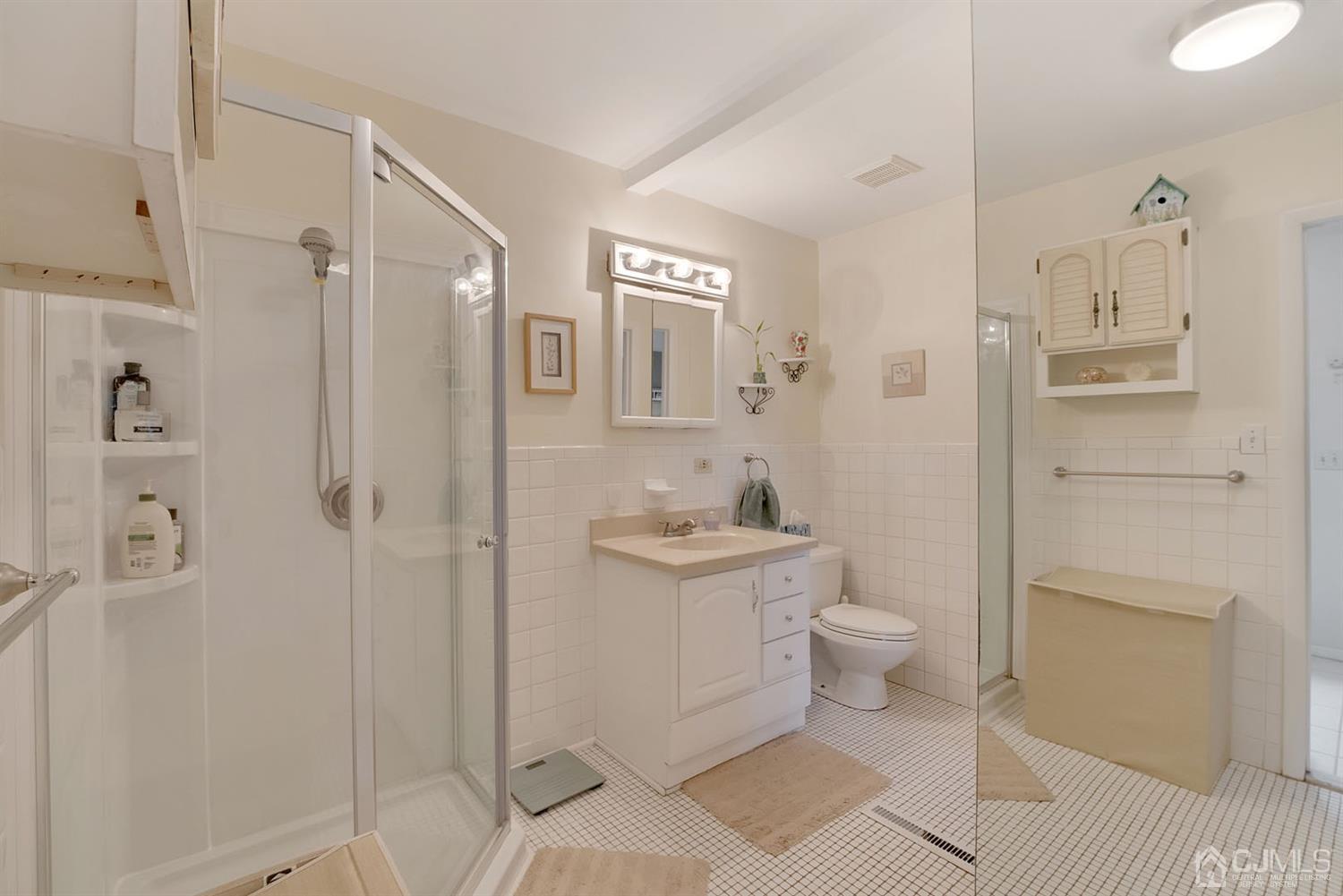 30 Savage Road Kendall Park, NJ 08824 - Photo 10 of 20 a bathroom with a granite countertop sink a toilet and shower