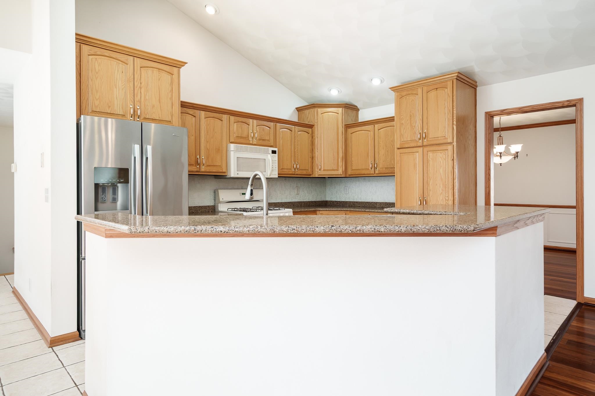 261 West Redtail Lane Oregon, IL 61061 - Photo 13 of 63 a bathroom with a granite countertop sink and a mirror