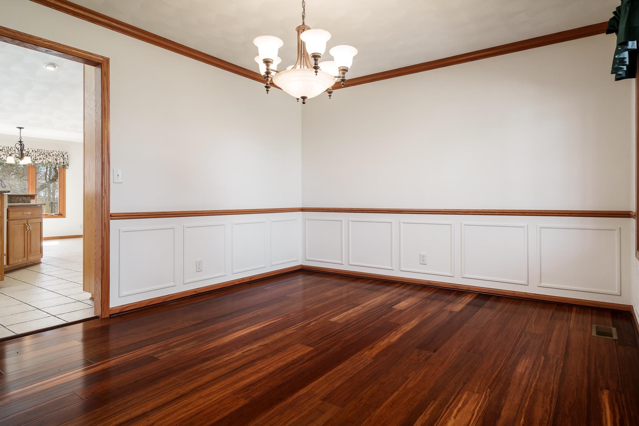 261 West Redtail Lane Oregon, IL 61061 - Photo 21 of 63 a view of a room with wooden floor chandelier and a window