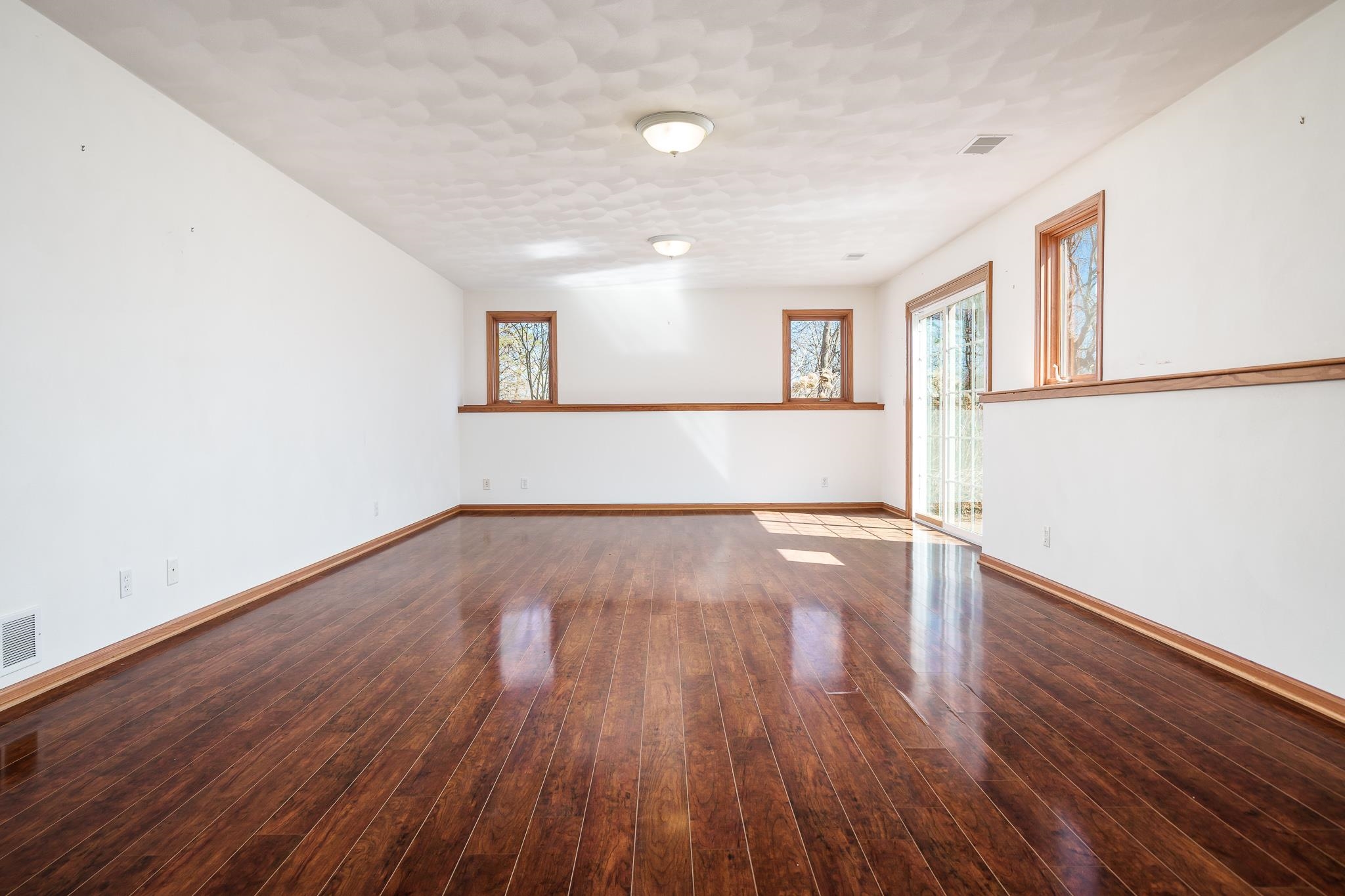 261 West Redtail Lane Oregon, IL 61061 - Photo 41 of 63 a view of empty room with wooden floor and fan
