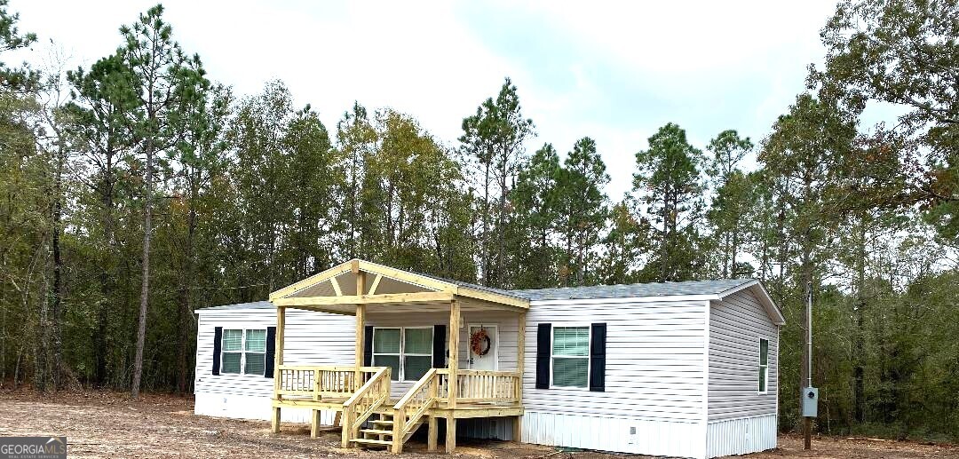 519 Wilson Road Twin City, GA 30471 - Photo 20 of 20 a front view of a house with garden
