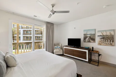 a bedroom with a bed and a tv