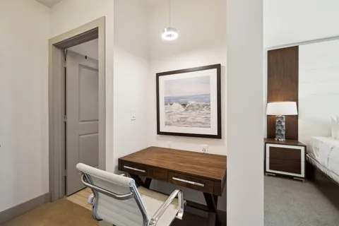 a view of a livingroom with furniture and windows