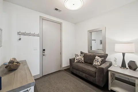 a living room with furniture and a window