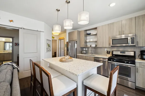 a kitchen with a dining table and chairs
