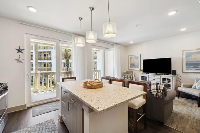 a view of a dining room and livingroom furniture wooden floor and a chandelier