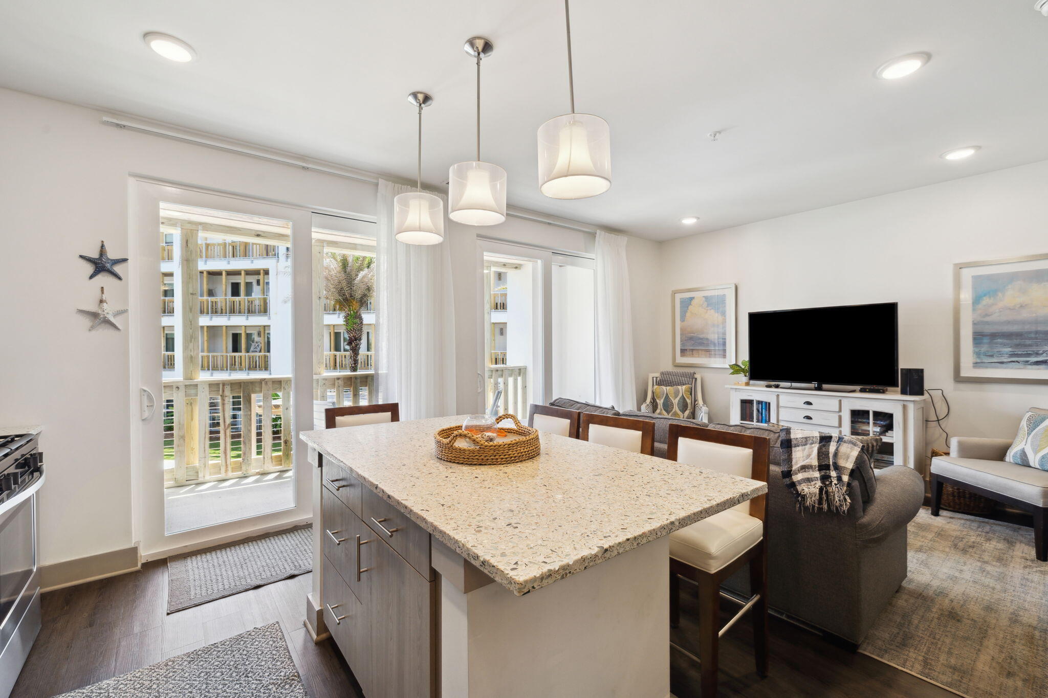 10941 East County Highway 30A, Unit 325 Inlet Beach, FL 32461 - Photo 7 of 36 a view of a dining room and livingroom furniture wooden floor and a chandelier