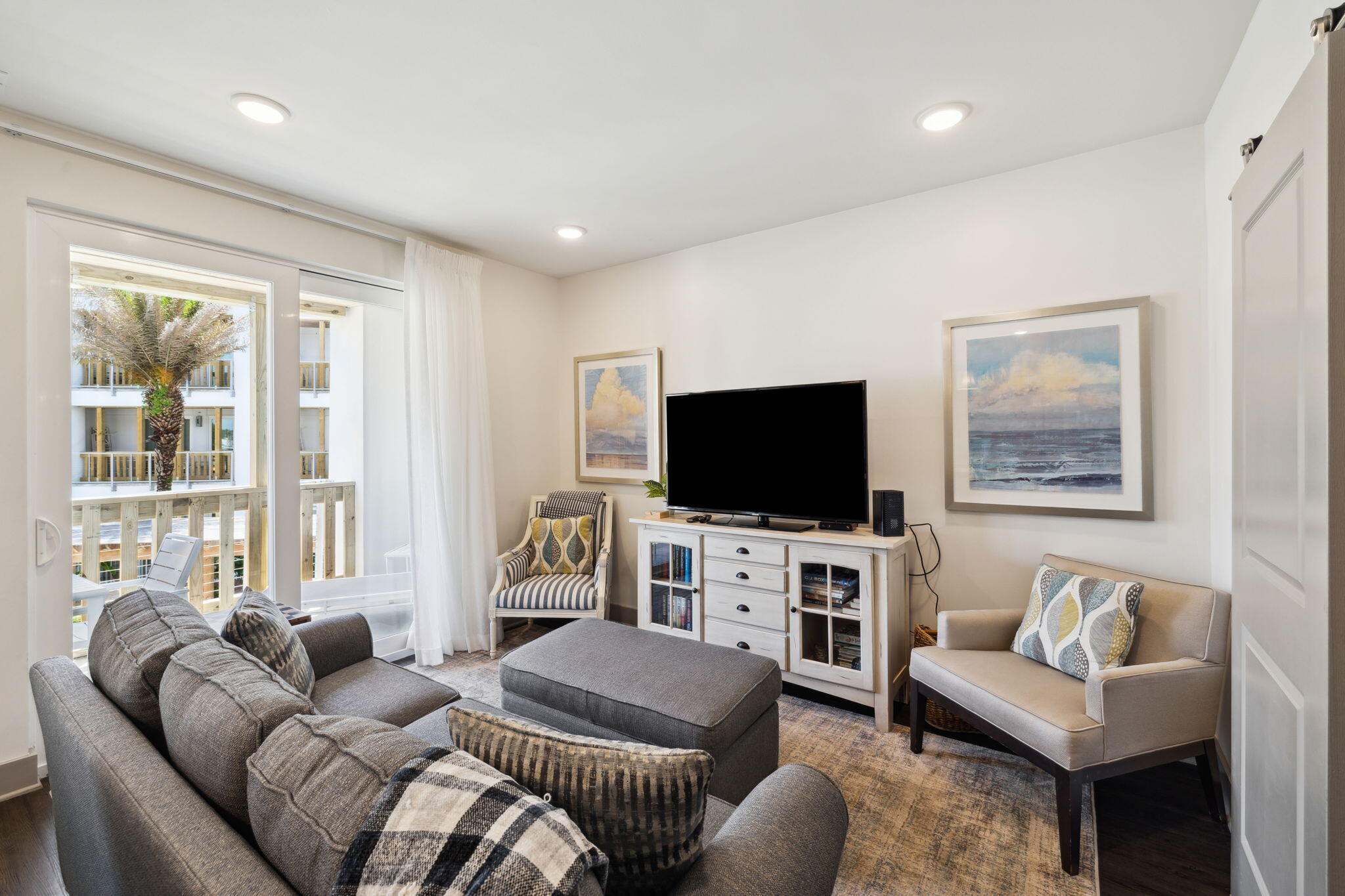 10941 East County Highway 30A, Unit 325 Inlet Beach, FL 32461 - Photo 8 of 36 a living room with furniture and a flat screen tv