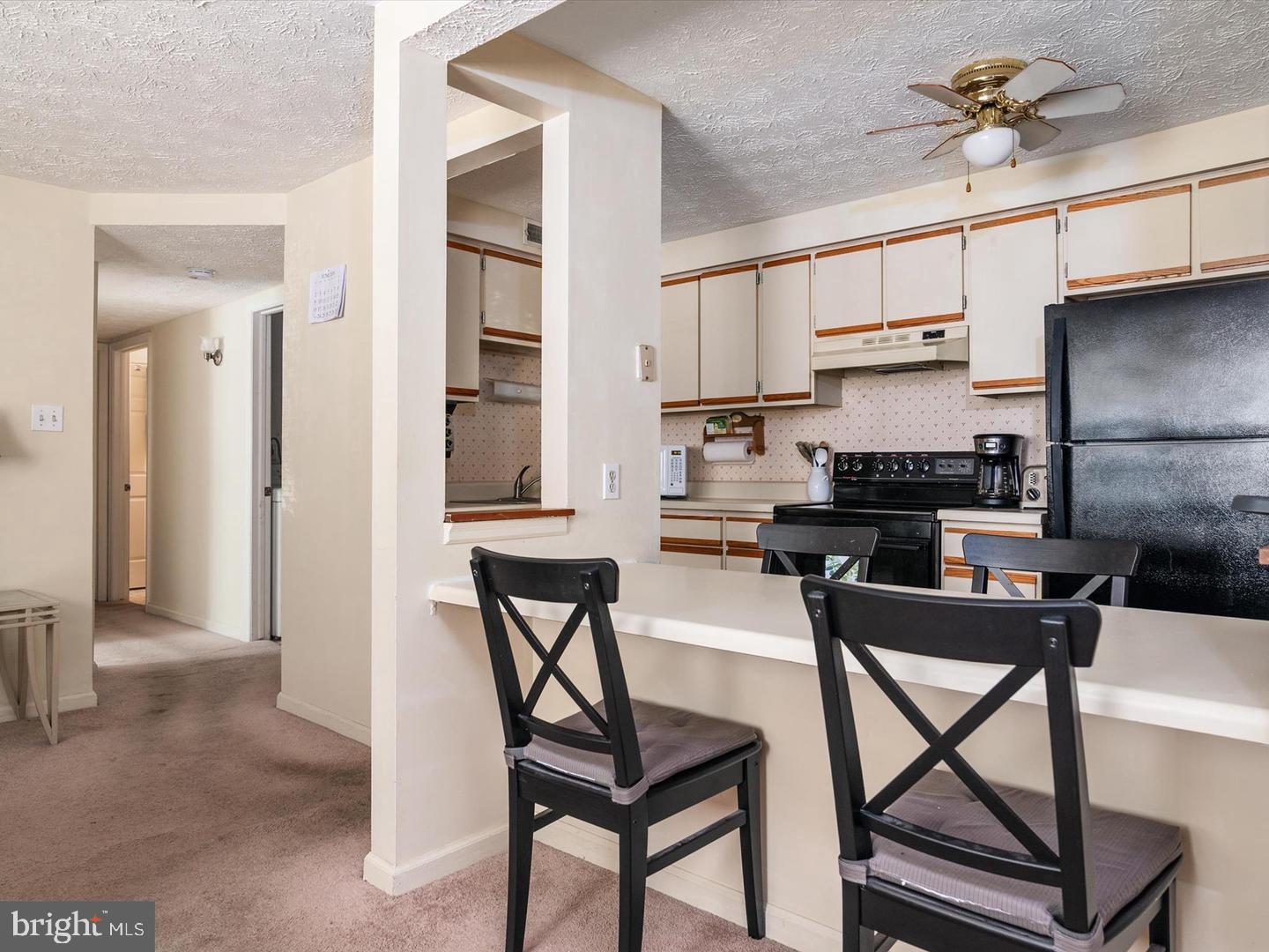 8028 Abbey Court, Unit C Pasadena, MD 21122 - Photo 6 of 12 a view of a dining room with furniture