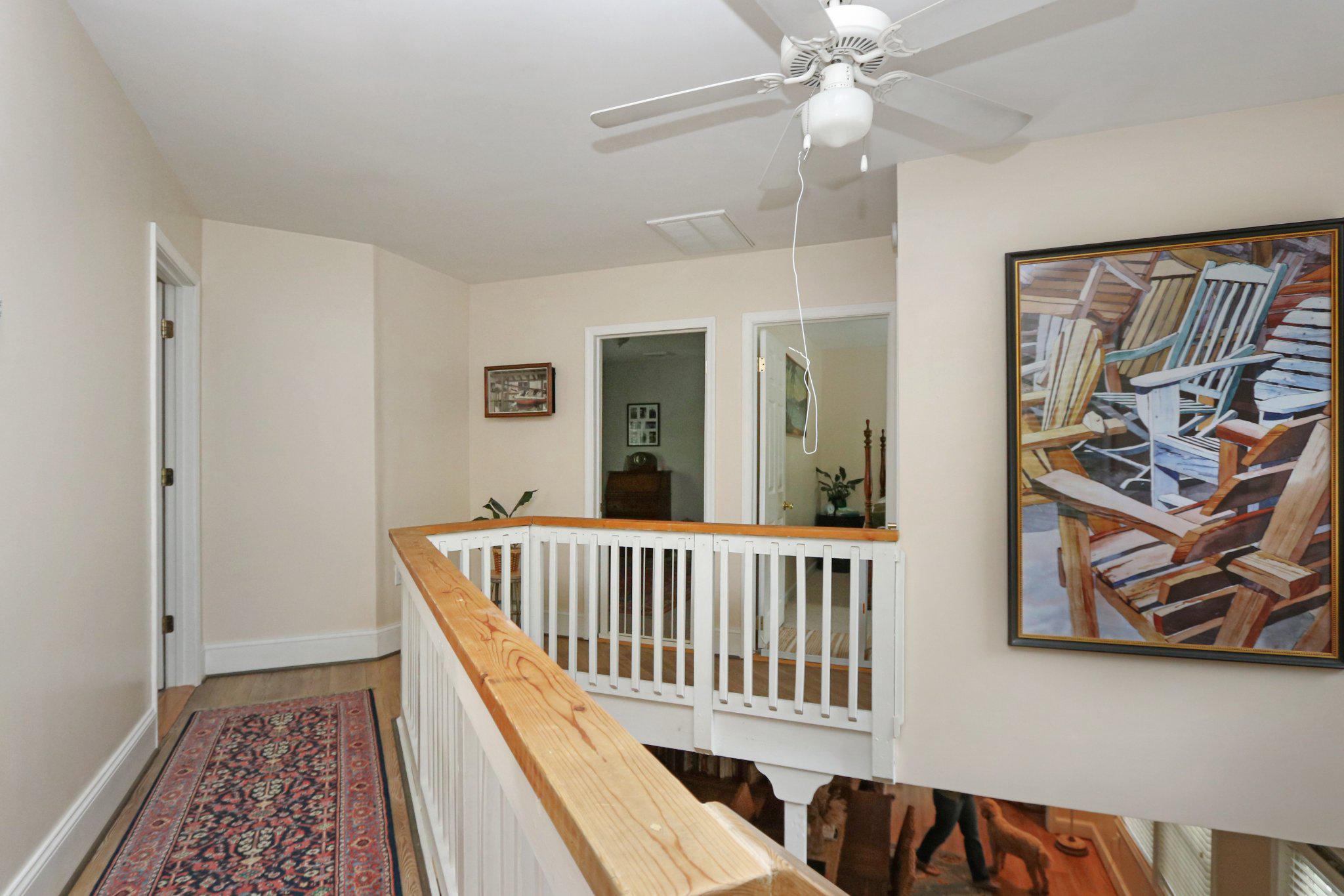 13431 Solitude Trail Machipongo, VA 23405 - Photo 21 of 32 Bright and airy hallway with art.