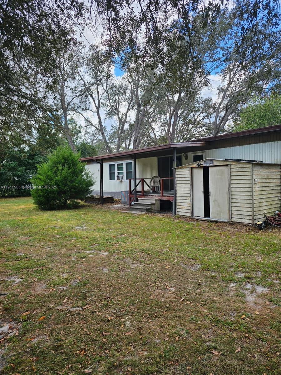 18620 Wildlife Trail, Unit 18620 Spring Hill, FL 34610 - Photo 1 of 19 a front view of house with yard and green space