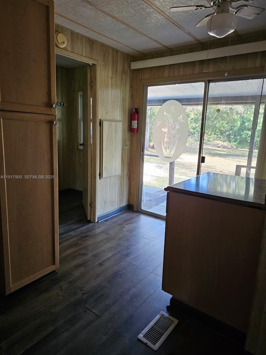 18620 Wildlife Trail, Unit 18620 Spring Hill, FL 34610 - Photo 15 of 19 an empty room with wooden floor and windows