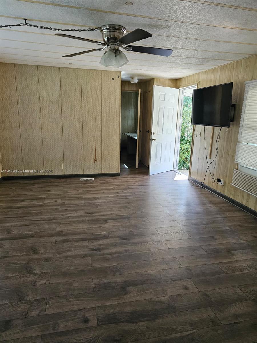 18620 Wildlife Trail, Unit 18620 Spring Hill, FL 34610 - Photo 5 of 19 a view of a livingroom with wooden floor