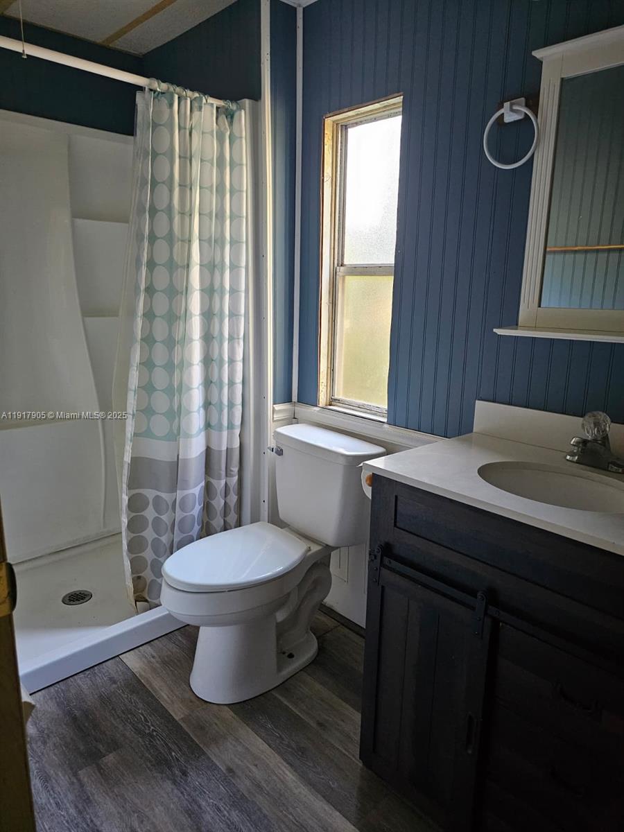18620 Wildlife Trail, Unit 18620 Spring Hill, FL 34610 - Photo 9 of 19 a bathroom with a sink toilet a mirror and shower