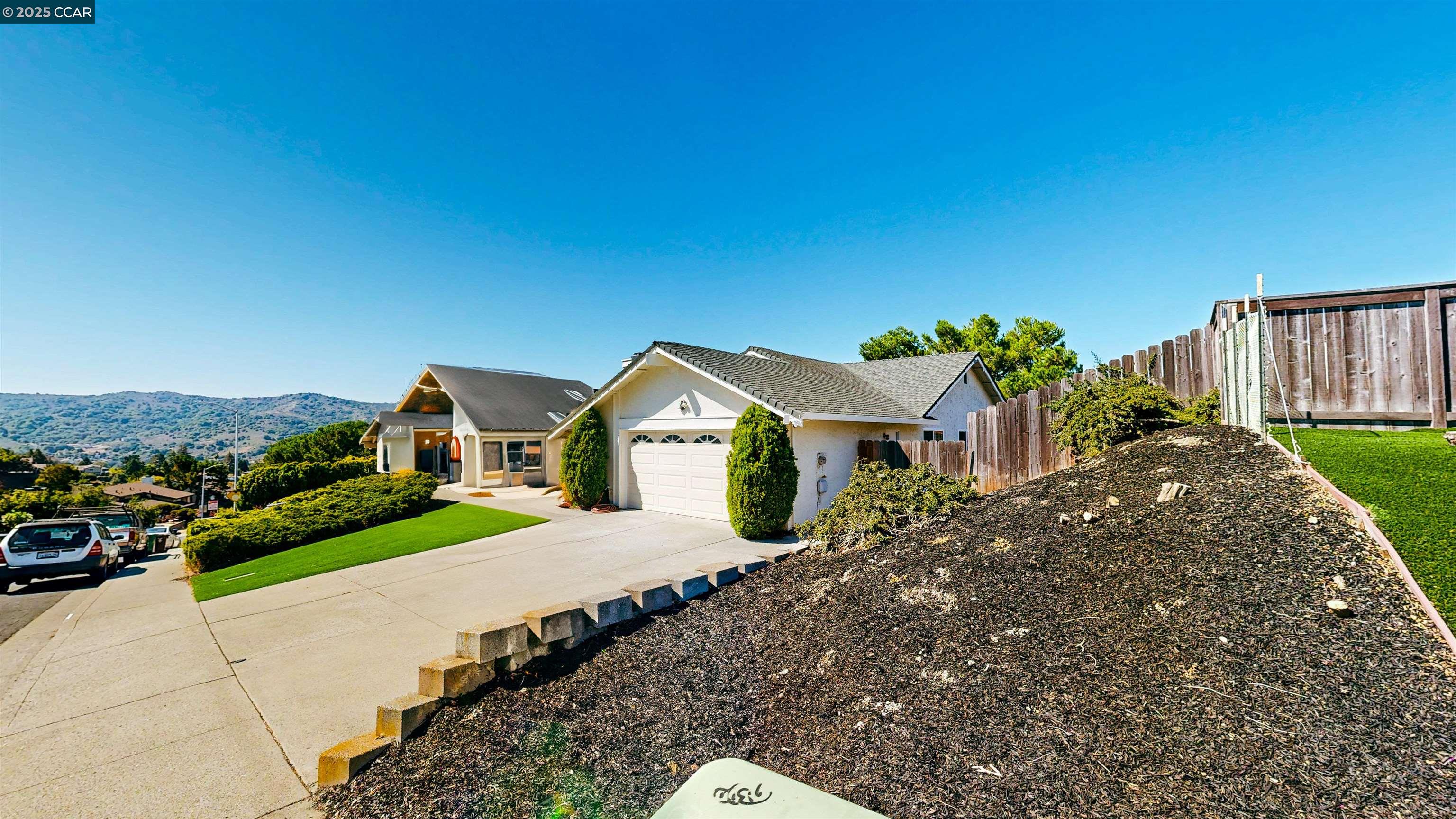3743 Painted Pony Road Richmond, CA 94803 - Photo 2 of 56 a front view of a house with a yard