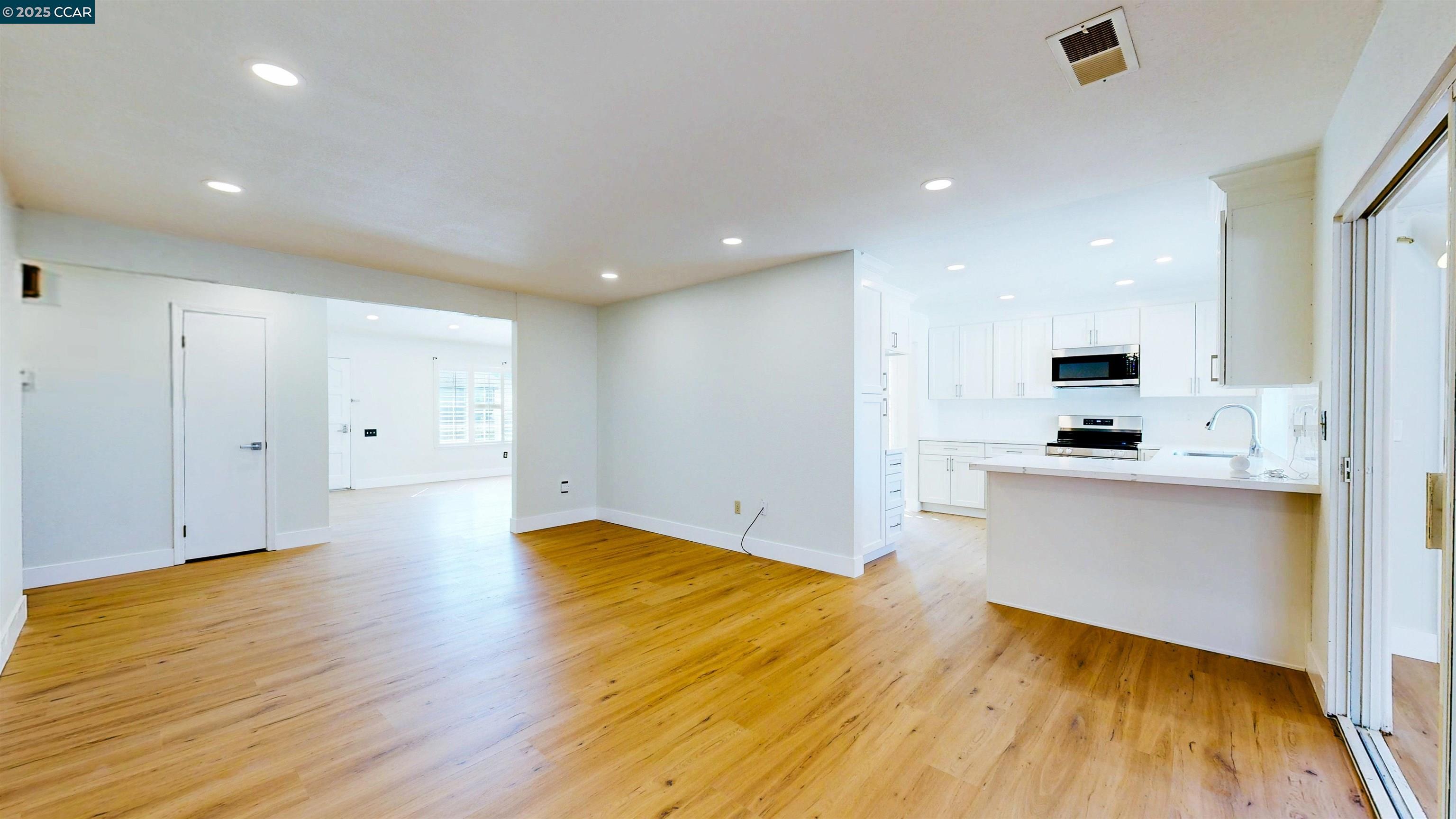 3743 Painted Pony Road Richmond, CA 94803 - Photo 22 of 56 a view of kitchen with wooden floor and electronic appliances