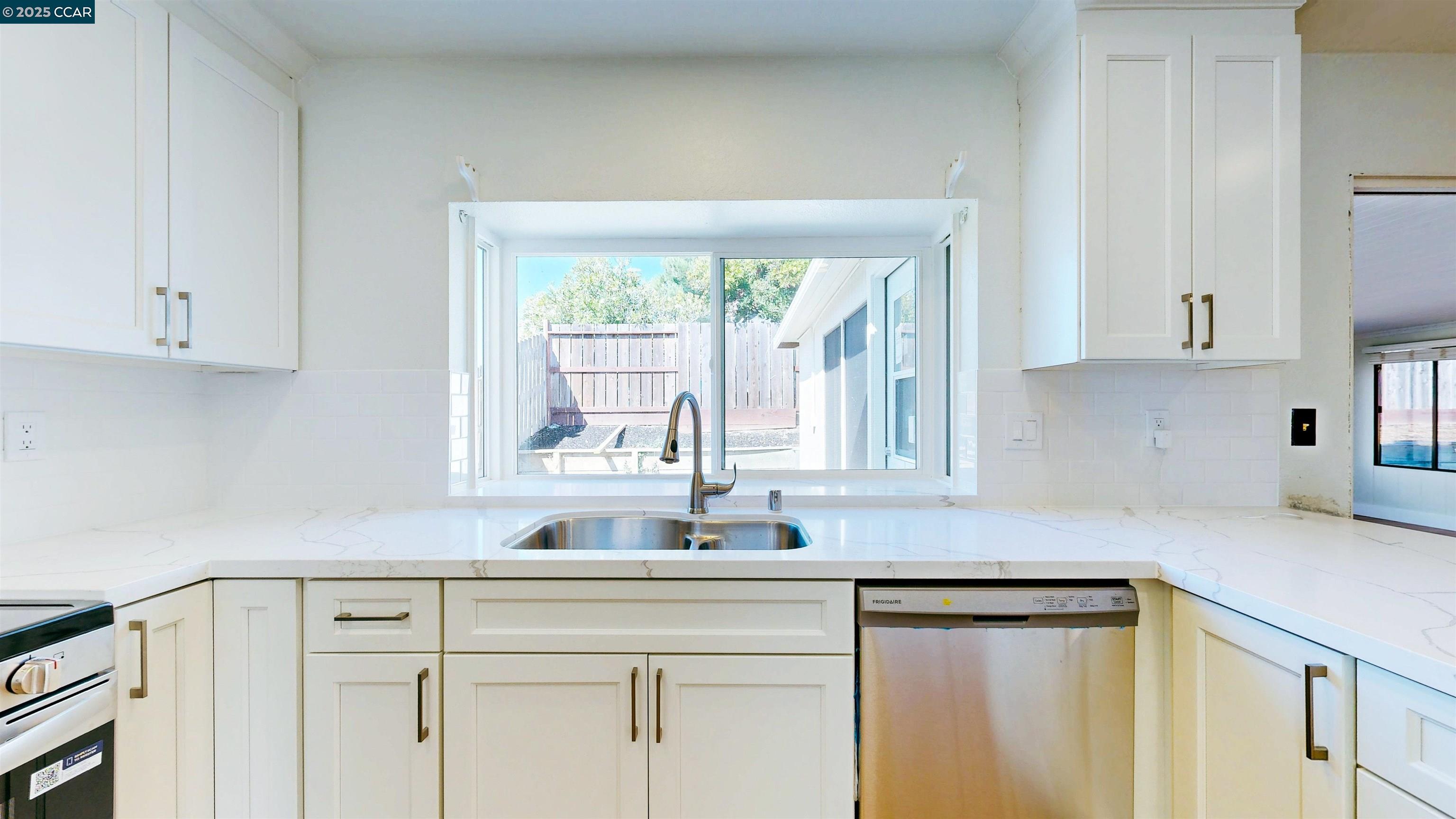 3743 Painted Pony Road Richmond, CA 94803 - Photo 25 of 56 a kitchen with stainless steel appliances white cabinets and a sink