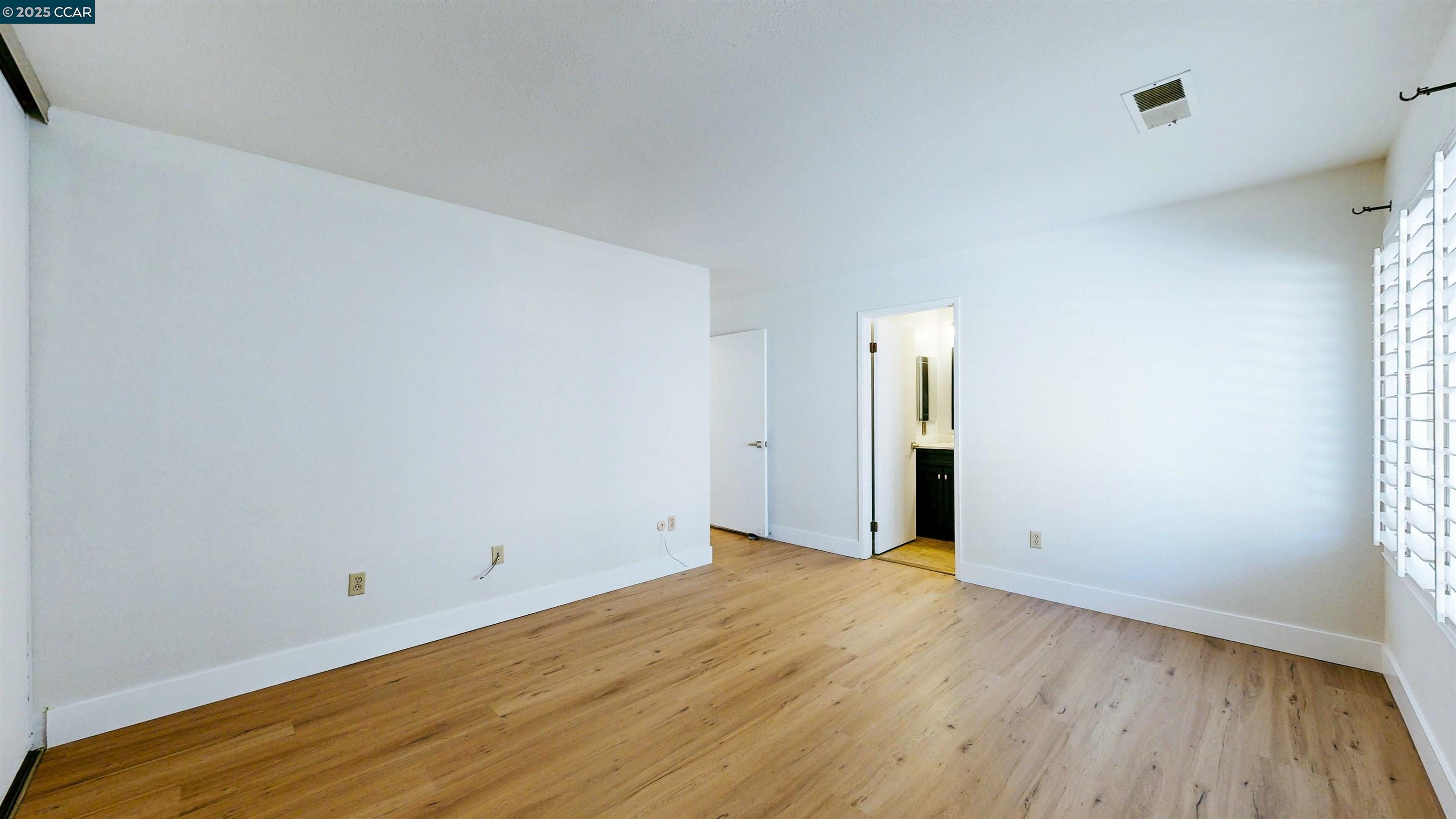 3743 Painted Pony Road Richmond, CA 94803 - Photo 39 of 56 a view of an empty room with wooden floor
