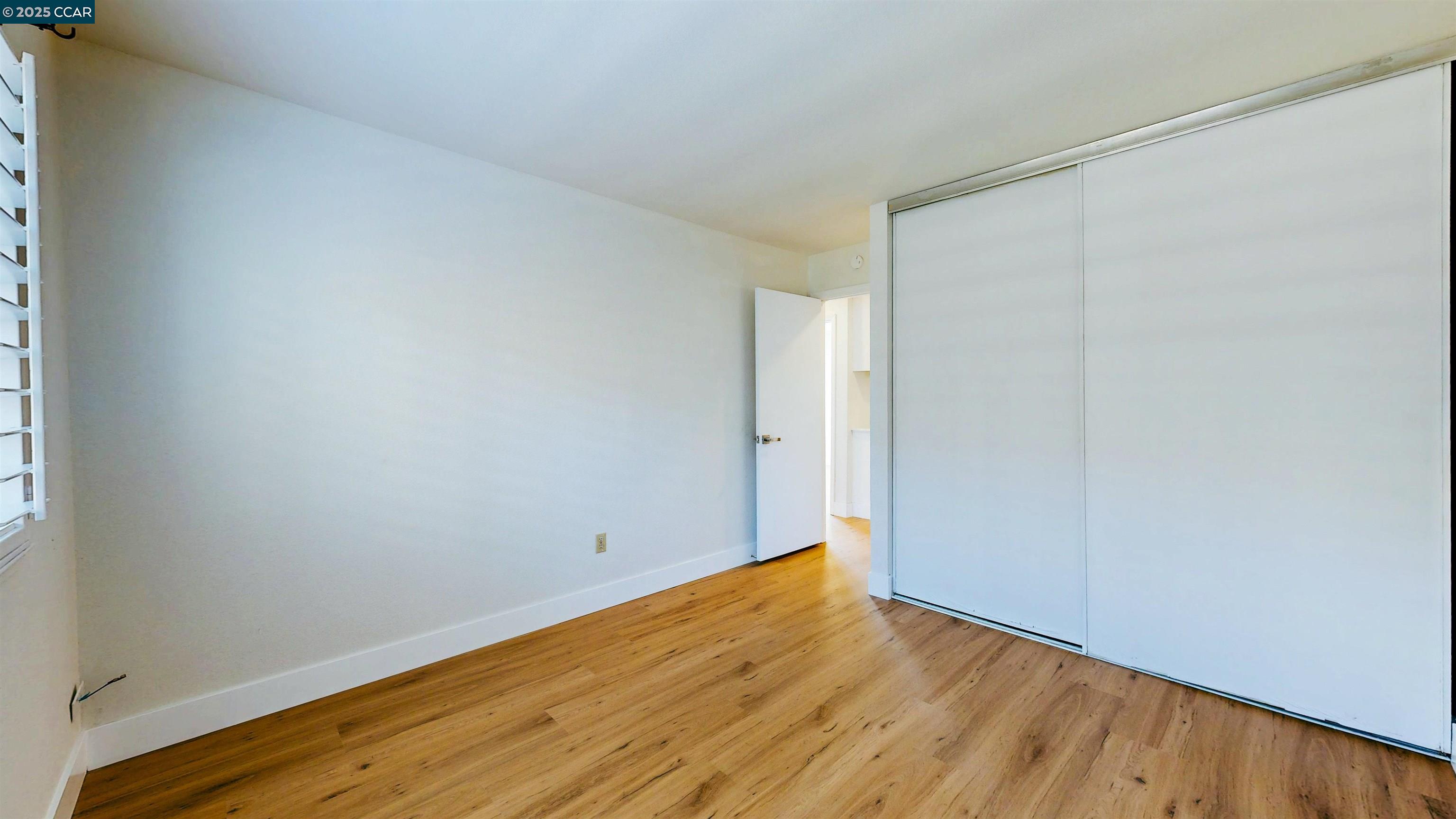 3743 Painted Pony Road Richmond, CA 94803 - Photo 41 of 56 a view of an empty room with wooden floor