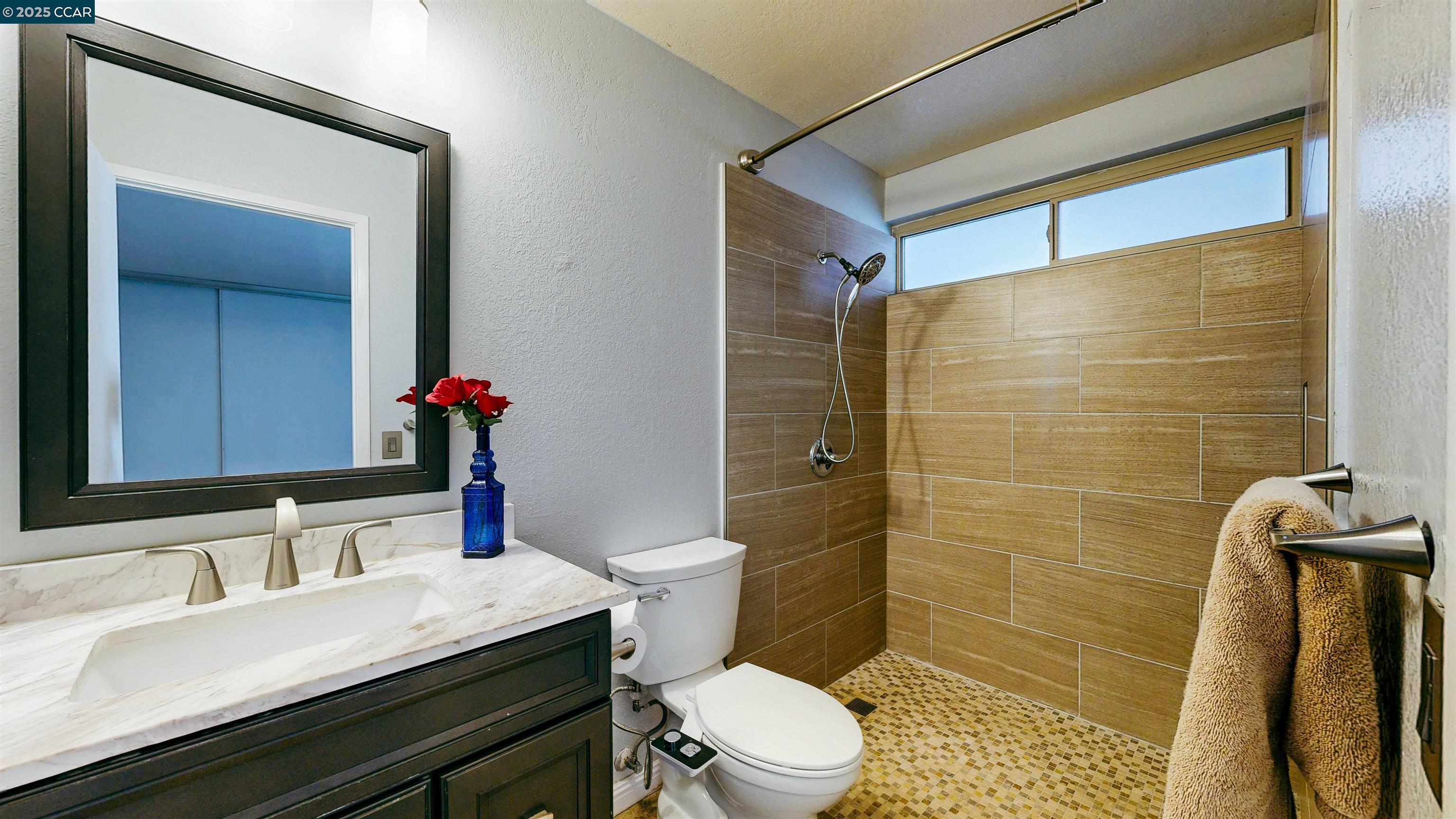 3743 Painted Pony Road Richmond, CA 94803 - Photo 42 of 56 a bathroom with a sink a toilet and shower