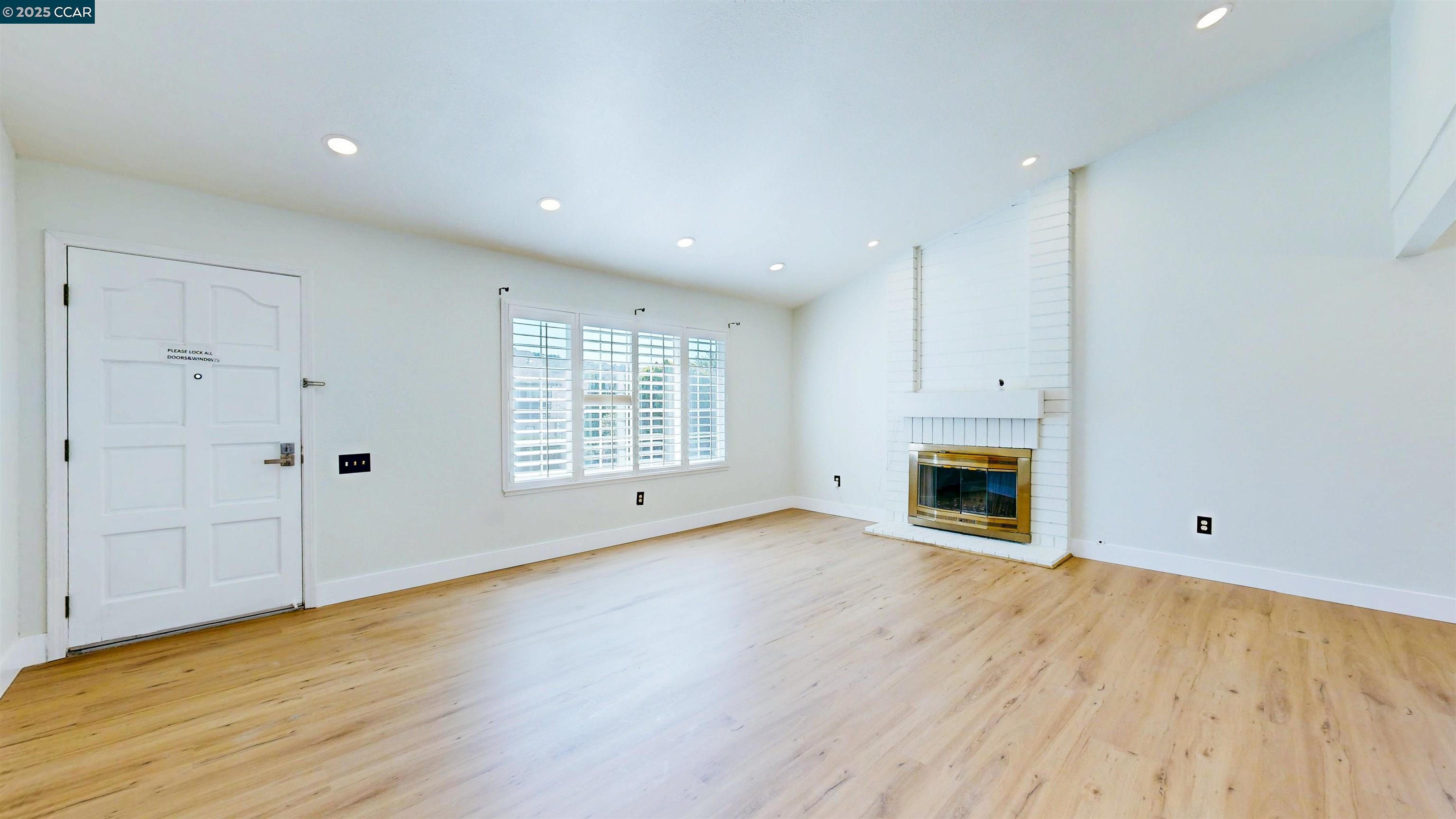 3743 Painted Pony Road Richmond, CA 94803 - Photo 10 of 56 a view of an empty room with wooden floor and a window