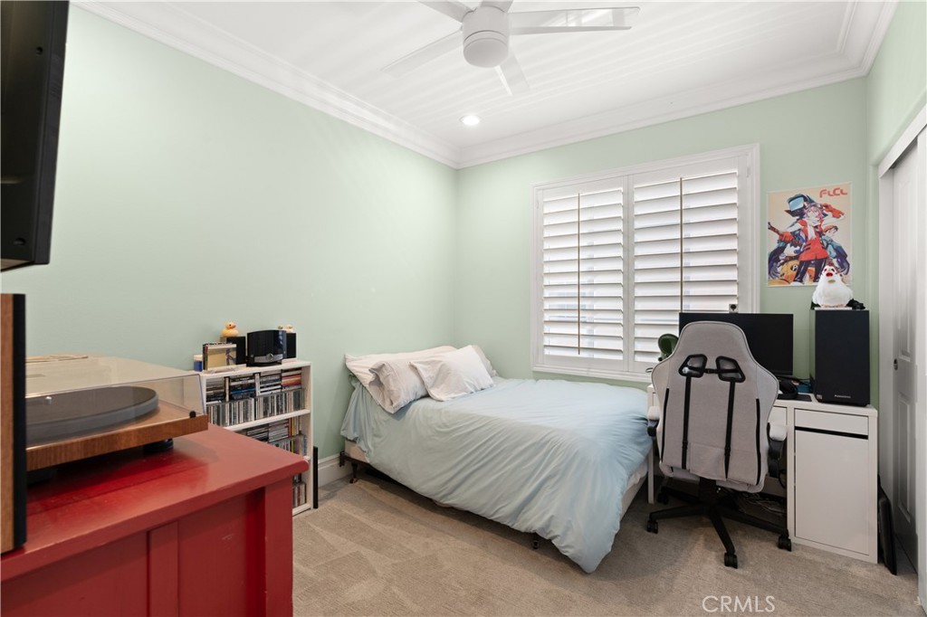 6572 Beachview Drive Huntington Beach, CA 92648 - Photo 11 of 17 a bedroom with a bed and a television
