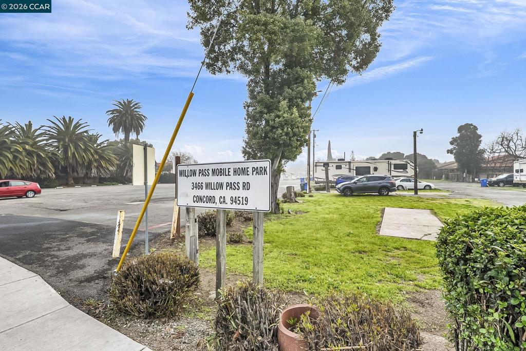 3466 Willow Pass Road Concord, CA 94519 - Photo 23 of 24 a sign board with a yard and trees