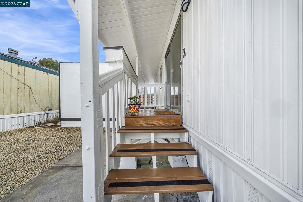3466 Willow Pass Road Concord, CA 94519 - Photo 3 of 24 a view of staircase with white walls and a window