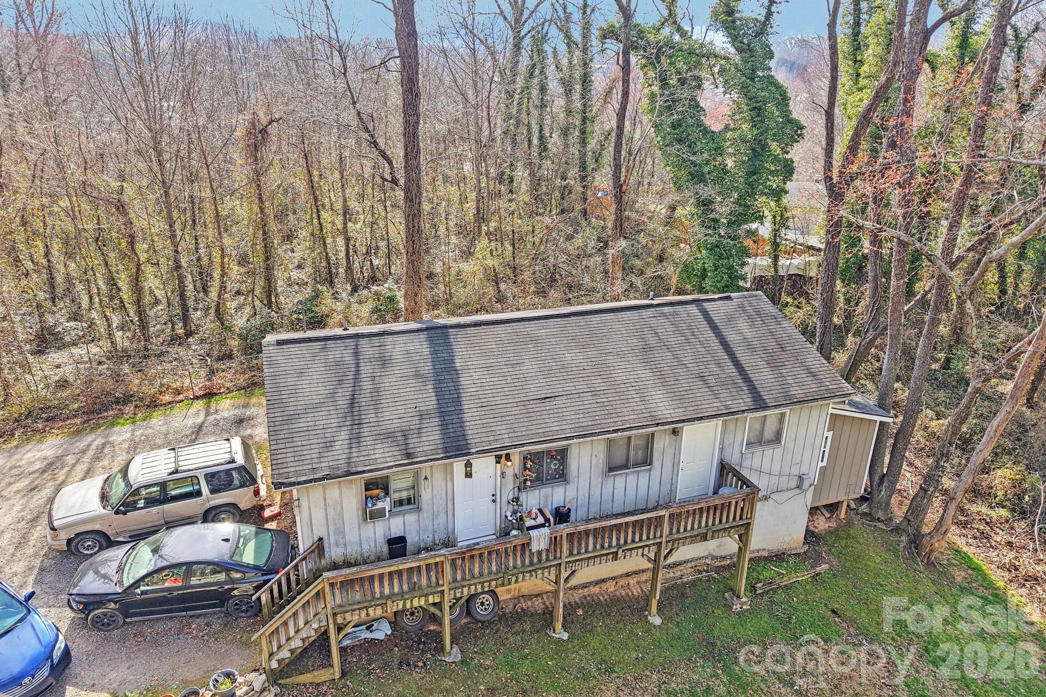 97-99 Forest Drive Clyde, NC 28721 - Photo 1 of 11 a view of backyard with deck and seating space
