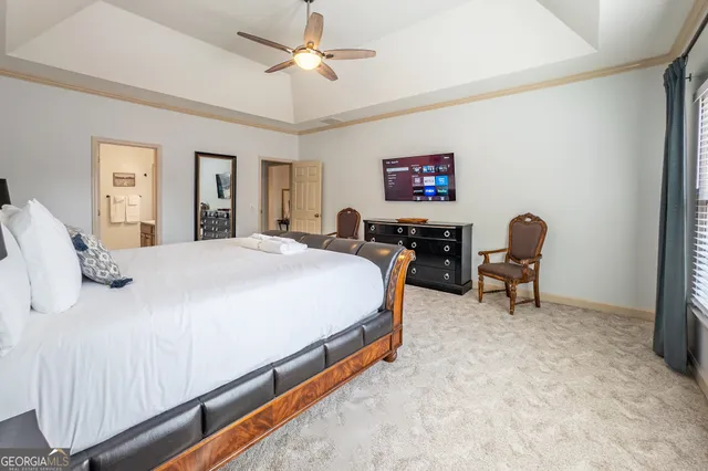 a bedroom with a bed furniture and a window