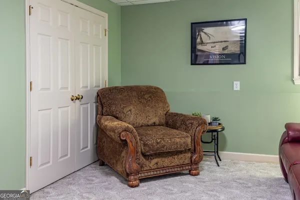 a utility room with furniture and a window